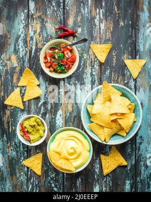 Nachos and assorted dips Stock Photo