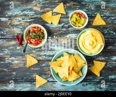 Nachos and assorted dips Stock Photo