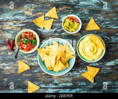 Nachos and assorted dips Stock Photo