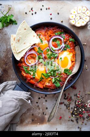 Shakshuka with pita bread Stock Photo