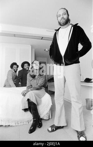 Rose Royce, Americn soul band, who are currently on tour in the UK, 28th September 1978.  They are currently at No.3 in the charts with 'Love Don't Live Here Anymore'.  In foreground , lead vocalist Gwen Dickey, also pictured, their security guard 'Buzzy', who is 6ft 5in & 300lb. Stock Photo