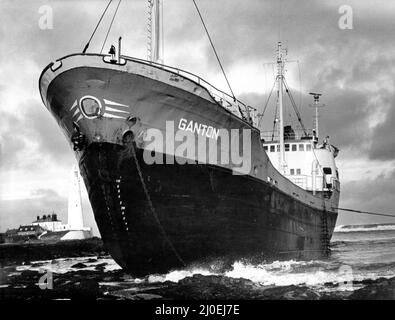 North East Shipwrecks -  The battered 400-tom coaster Ganton lay stranded having run aground on rocks near St Mary's Island, Whitley Bay. Tynemouth lifeboat was called out to take the four crew memebers to safety.   The four were later named as Ian Cowie, of Blyth, Howard Russell, of Berwick and Scotmen Stuart Barrie and Wayne Smith.   But as rescuers prepared for the tricky salvage operatiion skipper John Tullough and engineer Bill Sannon sat it out at Curry's Point, Whitley Bay, where the Ganton went ashore.   The ship's owners, the Edinburgh-based Lindsay Line, were conmfident that the ship Stock Photo