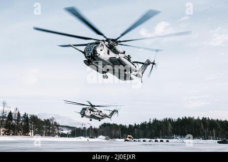 U.S. Marine Corps CH-53E Super Stallions with Marine Heavy Helicopter Squadron 366 (HMH-366), 2nd Marine Aircraft Wing, depart a landing zone during Exercise Cold Response 22 in Setermoen, Norway, March 15, 2022. Exercise Cold Response 22 is a biennial Norwegian national readiness and defense exercise that takes place across Norway, with participation from each of its military services, including 26 North Atlantic Treaty Organization (NATO) allied nations and regional partners. (U.S. Marine Corps photo by Sgt. William Chockey) Stock Photo