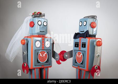 Two robots getting married Stock Photo