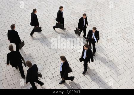 High view of a businessman walking round in circles Stock Photo