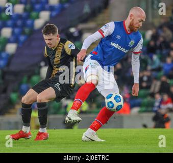 Windsor Park, Belfast, Northern Ireland,  UK. 08 Feb 2022. Danske Bank Premiership – Linfield 2 Larne 1. Linfield's Chris Shields (blue) turns Larne's Ronan Hale. Stock Photo