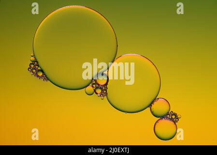 Bright abstract, yellow background with flying bubbles Stock Photo