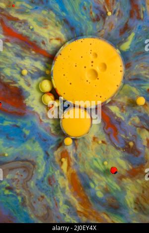 Colorful artistic background with different colors mixed with oil and milk Stock Photo