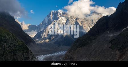 Moon rise on Les Grandes Jorasses and the Mer de Glace glacier. View of Vallee Blanche of the Mont Blanc massif in the Alps. Chamonix, Haute-Savoie Stock Photo