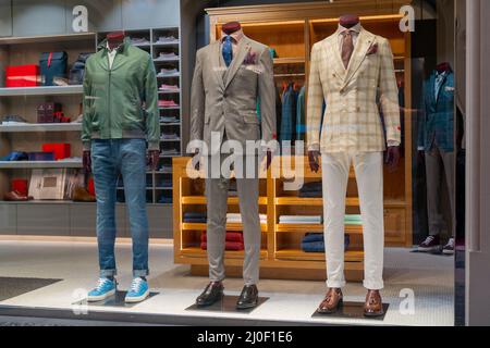 Male dummy in a shop window. Sale of men's clothing. Stock Photo