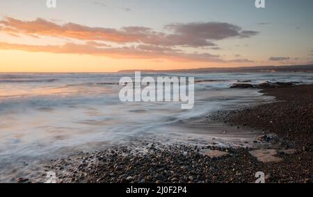 Dramatic Sunset over a rocky coast, Akrotiri Limassol Cyprus Stock Photo