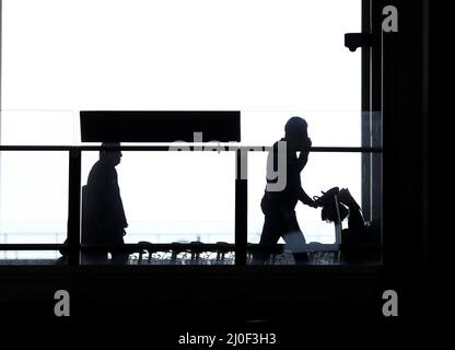 London, UK. 18th Mar, 2022. Passengers walk in Heathrow Airport in London, UK, March 18, 2022. The British government removed all remaining COVID restrictions on international travel for all passengers from 4 a.m. local time on Friday. Credit: Li Ying/Xinhua/Alamy Live News