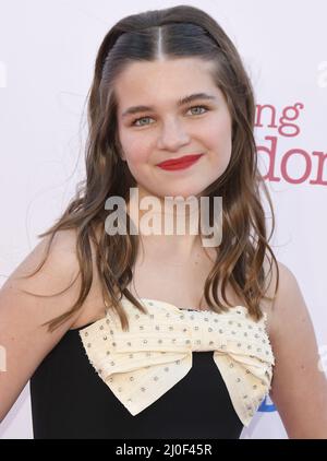 Raegan Revord arrives at the Premiere Of Warner Bros. 100th Episode Of ...