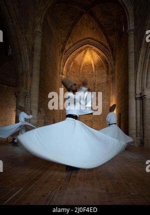 Dervishes performing the traditional religious whirling dance. Northern cyprus Stock Photo