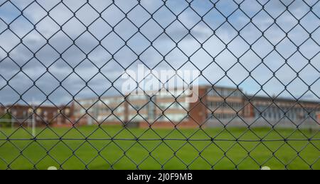 High School Building Behind A Fence Stock Photo