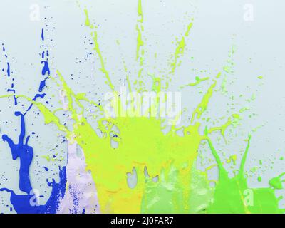 Volumetric splashes of bright multi-colored paints on a light background. 3D rendering Stock Photo