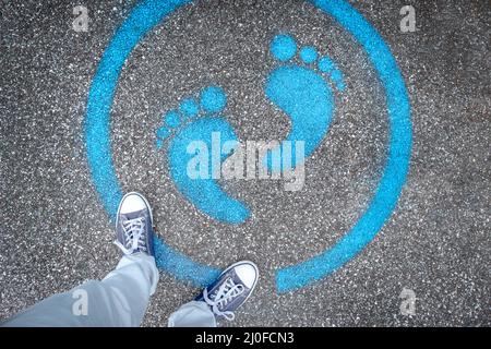 Man standing on blue dot Stock Photo