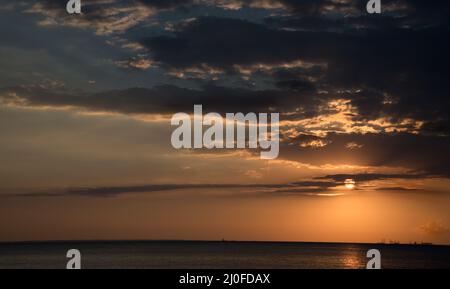 Dramatic sunset over the ocean Stock Photo