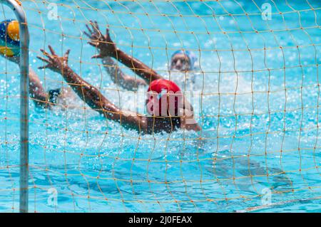 Unrecognized athletes on a water polo championship game Stock Photo