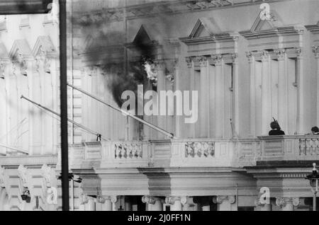 Final day of the Iranian Embassy Siege in London where six gunmen of the Iranian extremist group 'Democratic Revolutionary Movement for the Liberation of Arabistan' stormed the building, taking 26 hostages before the SAS retook the embassy and freed the hostages.Two SO19 officers stand on the balcony of the building adjacent to the Embassy, after SAS soldiers threw thunderflashes through the windown to stun the hostages and terrorists inside and end the siege. 5th May 1980. Stock Photo