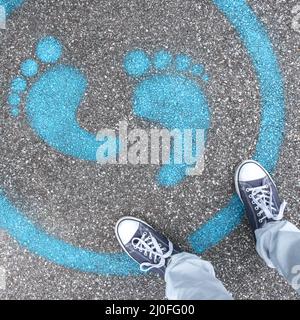 Man standing on blue dot Stock Photo