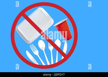 Single use plastic cutlery, styrofoam takeaway boxes and plastic glass on a blue background. Concept: Ban single use plastic ite Stock Photo