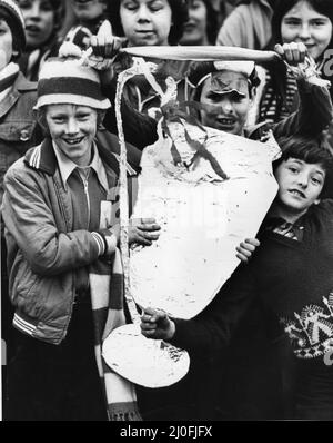 Enthusiastic Liverpool fans gathered in the city centre to welcome their team home from Wembley after their victory in the European Cup Final. Here a young fan holding a duplicate version of the famous European trophy as they wait for the team to parade the real one from an open top bus. 11th May 1978. Stock Photo