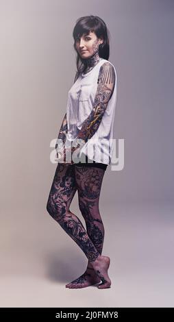 Black model covered in black body paint Stock Photo - Alamy