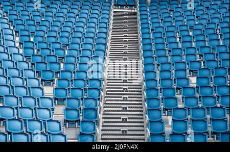 Blue plastic empty stadium  chairs in a row Stock Photo