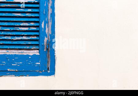 Blue window on a white wall Stock Photo