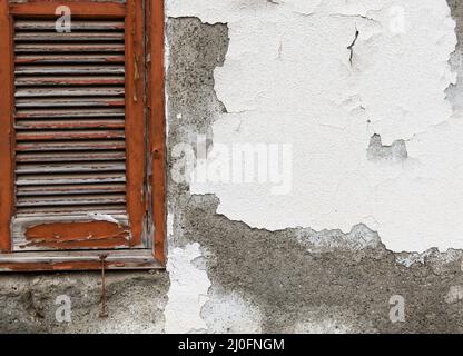 Red window on a white wall Stock Photo