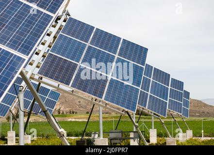 Solar energy Panels on a green field. Alternative energy, Energy from sun Stock Photo