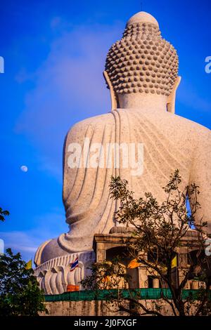 Amazing Massive white marble Buddha statue, the famous tourist attraction on top of hill in Phuket, Thailand. Stock Photo