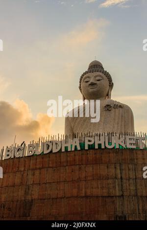 Amazing Massive white marble Buddha statue, the famous tourist attraction on top of hill in Phuket, Thailand. Stock Photo