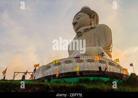 Amazing Massive white marble Buddha statue, the famous tourist attraction on top of hill in Phuket, Thailand. Stock Photo