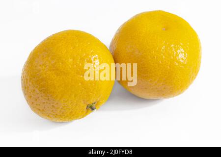 Two ripe tangerines on a white background Stock Photo
