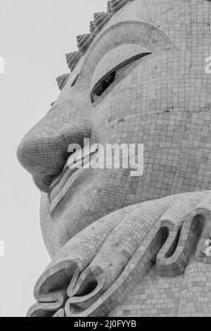 Amazing Massive white marble Buddha statue, the famous tourist attraction on top of hill in Phuket, Thailand. Stock Photo