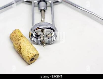 Steel wing corkscrew with a perforated cork Stock Photo
