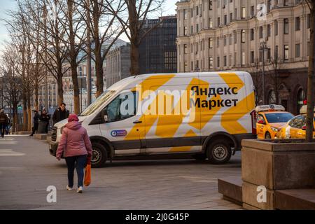 Moscow, Russia. 18th of March, 2022  A branded Yandex Market goods delivery vehicle is parked on the sidewalk on Tverskaya Street in the center of Moscow, Russia Stock Photo