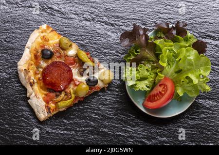 Pizza on slate Stock Photo