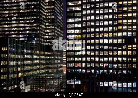 Modern office building in the Canary Wharf financial centre in London UK at night Stock Photo