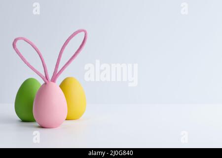 Colorful Easter eggs with bunny ears, holiday decoration Stock Photo