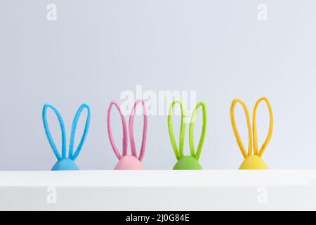 Colorful Easter eggs with bunny ears, holiday decoration Stock Photo
