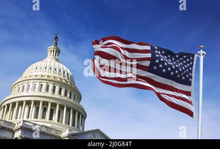 American flag waving with the US Capitol Hill Stock Photo
