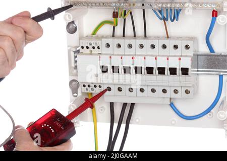 Electrician is testing a circuit Stock Photo