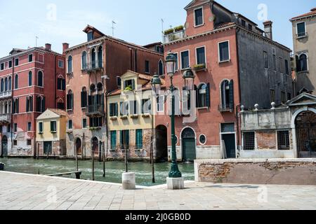 Beautiful old houses and one of the famous channels seen in Venice, Italy Stock Photo