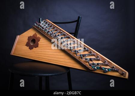 Russian folk musical instruments. Gusli isolated on a black background Stock Photo