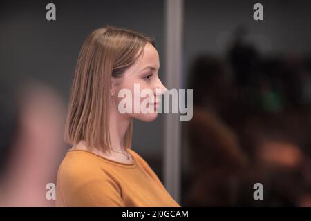 Portrait of freelancer standing in co-working space. Stock Photo