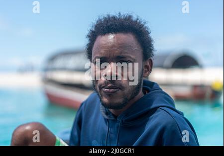 Young black man working on the coast Stock Photo