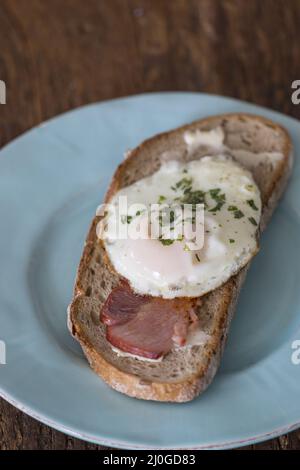 Bread with grilled ham and egg Stock Photo